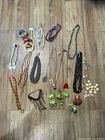 Full lot laid out showing necklaces, bangles, earrings