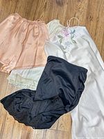 Group shot of all four garments on floor