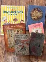 Front covers of six vintage hardcover books including Betty Crocker cookbook