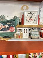 Front view of Coca-Cola garage scene clock