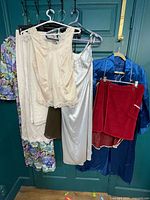 Multiple garments hanging showing variety and condition