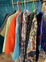 Rack showing 10 assorted tops in various colours and prints
