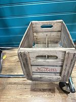 Angled view of crate showing Nesbitts logo and overall construction