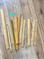 Group of rulers laid flat showing variety of lengths and materials