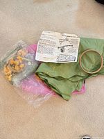 Overview of tablecloth fabric, floss bag, instruction sheet and hoop
