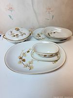 group of porcelain serving pieces showing full set arrangement