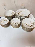 Overview of stacked dinner, salad, dessert plates and bowls