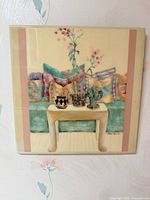 Full view of square framed wall plaque on wall