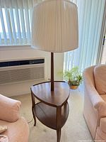 Full view showing lamp, shade, two-tier shelves, legs