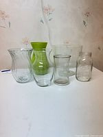 All six glass items grouped: five vases, one mason jar