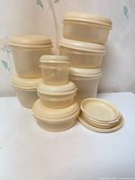 Full grouping of containers stacked with extra lids