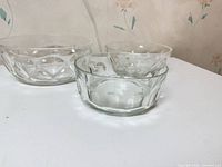 All three clear pressed glass mixing bowls side by side