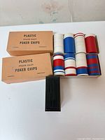 Overall view of chips in tray with two cardboard boxes and black plastic tray