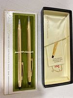Ballpoint pen and mechanical pencil displayed in open Cross box