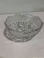 Top view of clear cut crystal bowl showing scalloped rim and floral cut pattern