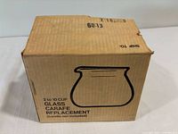 Front of cardboard box showing product outline and text