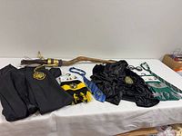 Entire set laid out showing robes, broom, ties, scarves