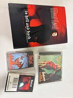 Group shot of book, two cassette tapes and CD