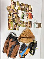 Overview of four gloves, cards/photos, Mets radio, boxed baseball