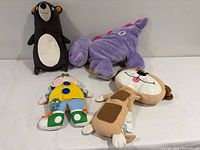 Group shot of all four plush pillows
