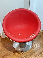 top view showing red padded seat and wear