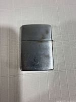 Front view of lighter lid closed