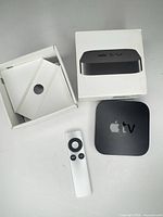 Apple TV unit, remote, open retail box