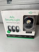 Front of retail package showing Arlo Security Light 3 Wire-Free Smart Lights