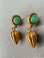 front view of both earrings showing cabochon tops and leaf drops