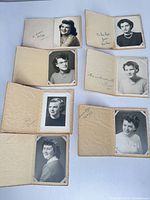 Seven wallet-size portrait photos displayed open to show images and covers