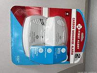 Front view of sealed 2-pack displaying both alarms and branding