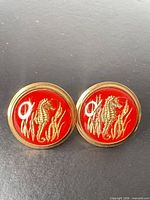 Both cufflinks front view showing design and color