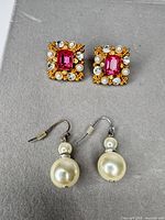 Stud cluster and dangle earrings front view