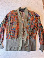 Full front view of paisley jacket with olive trim