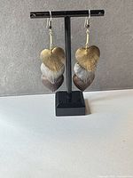 Front view showing layered heart shapes and mixed metal colors