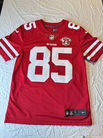 Full view of front of jersey displaying number 85, sleeve stripes, 75th patch