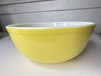 Side profile showing yellow exterior of bowl