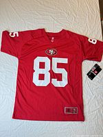 Full view of red 49ers #85 jersey front with tag attached