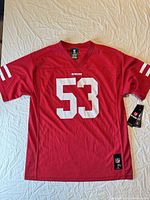 Front view of red 49ers #53 jersey with tags