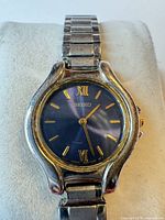 Front view of Seiko wristwatch showing blue dial and case wear