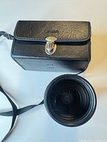 Lens with carrying case top view
