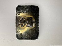 front view of rectangular two-tone floral belt buckle