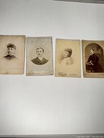 Group view of four cabinet cards laid out on white background