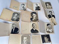 Overview of ten mounted black-and-white portrait photographs showing inscriptions and mounting style