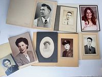 Group shot of eight mounted and loose portraits