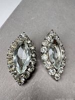 Both earrings front view showing overall design and condition