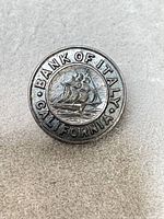 Front view showing sailing ship and Bank of Italy California text