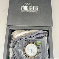 Clock inside original Waterford box showing bezel and dial