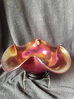 Top view showing iridescent stretch finish and ruffled rim