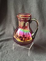 pitcher with tumbler inverted as lid showing iridescent finish